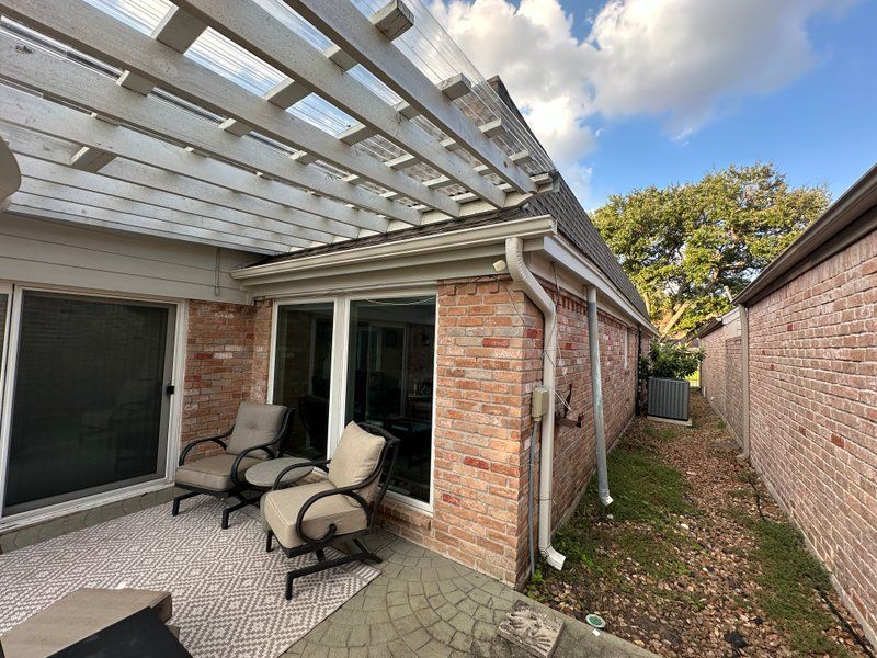 Covered patio with new gutter installation