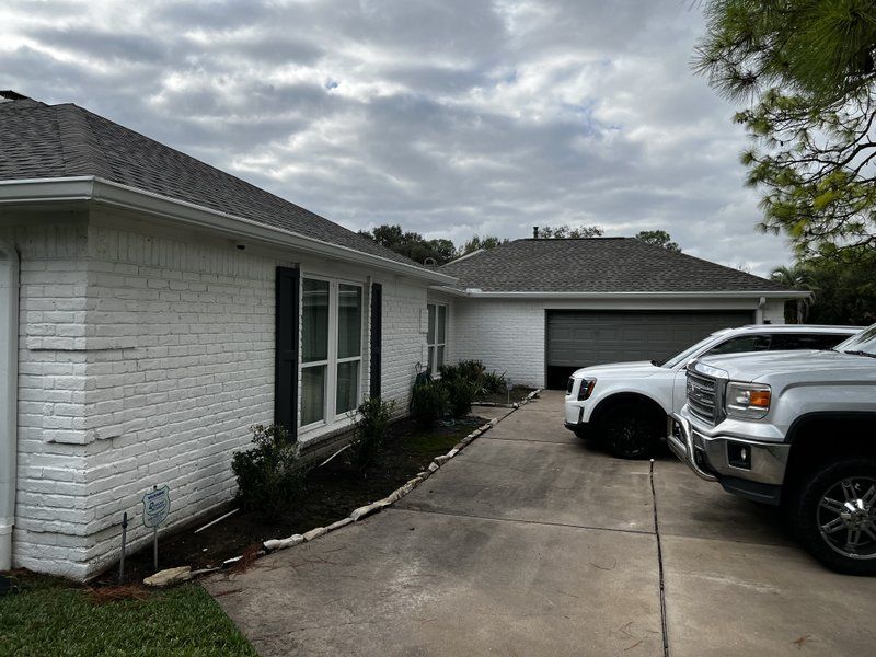Seamless gutters on a painted brick home
