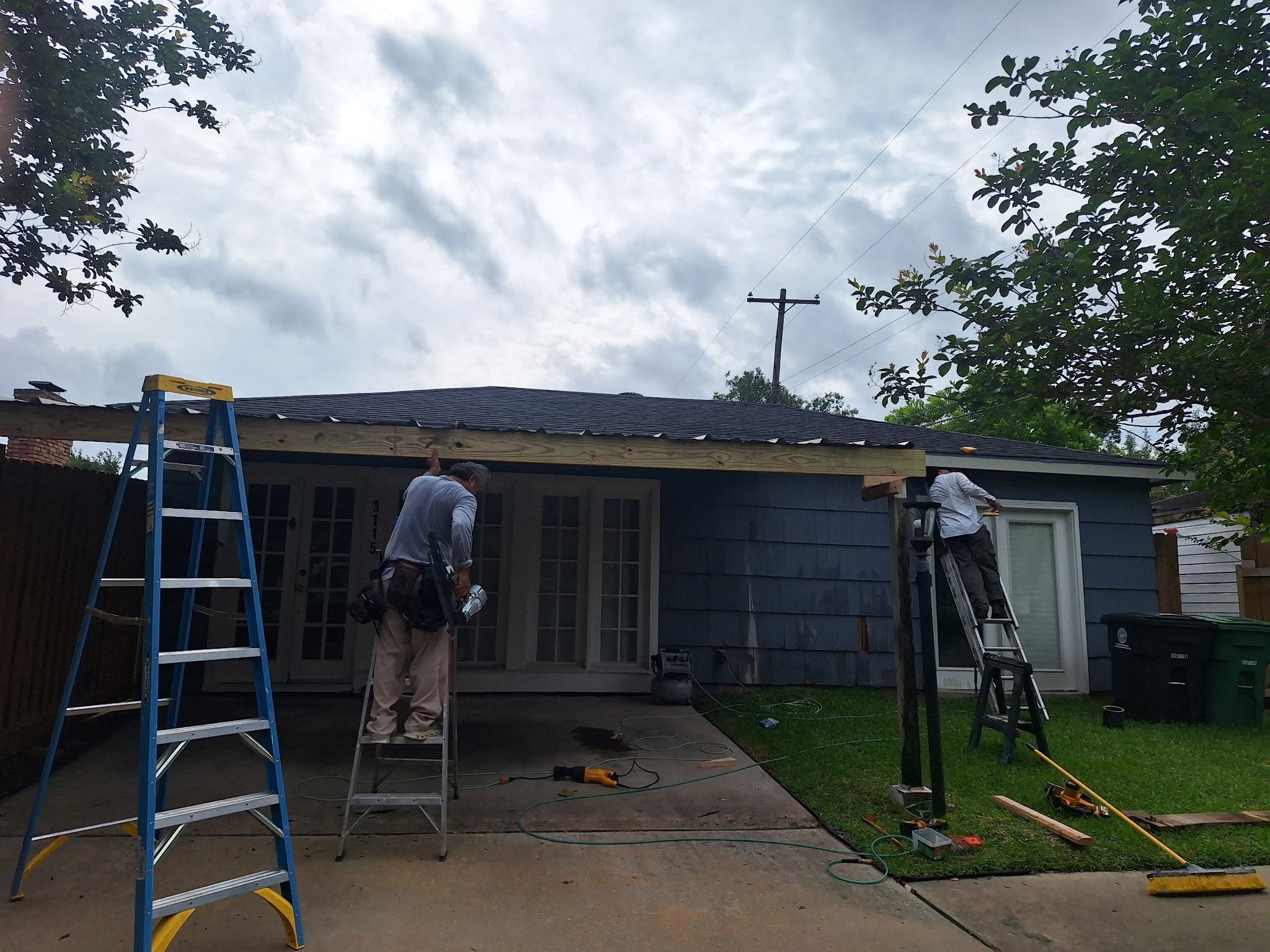 Mo City crew installing siding
