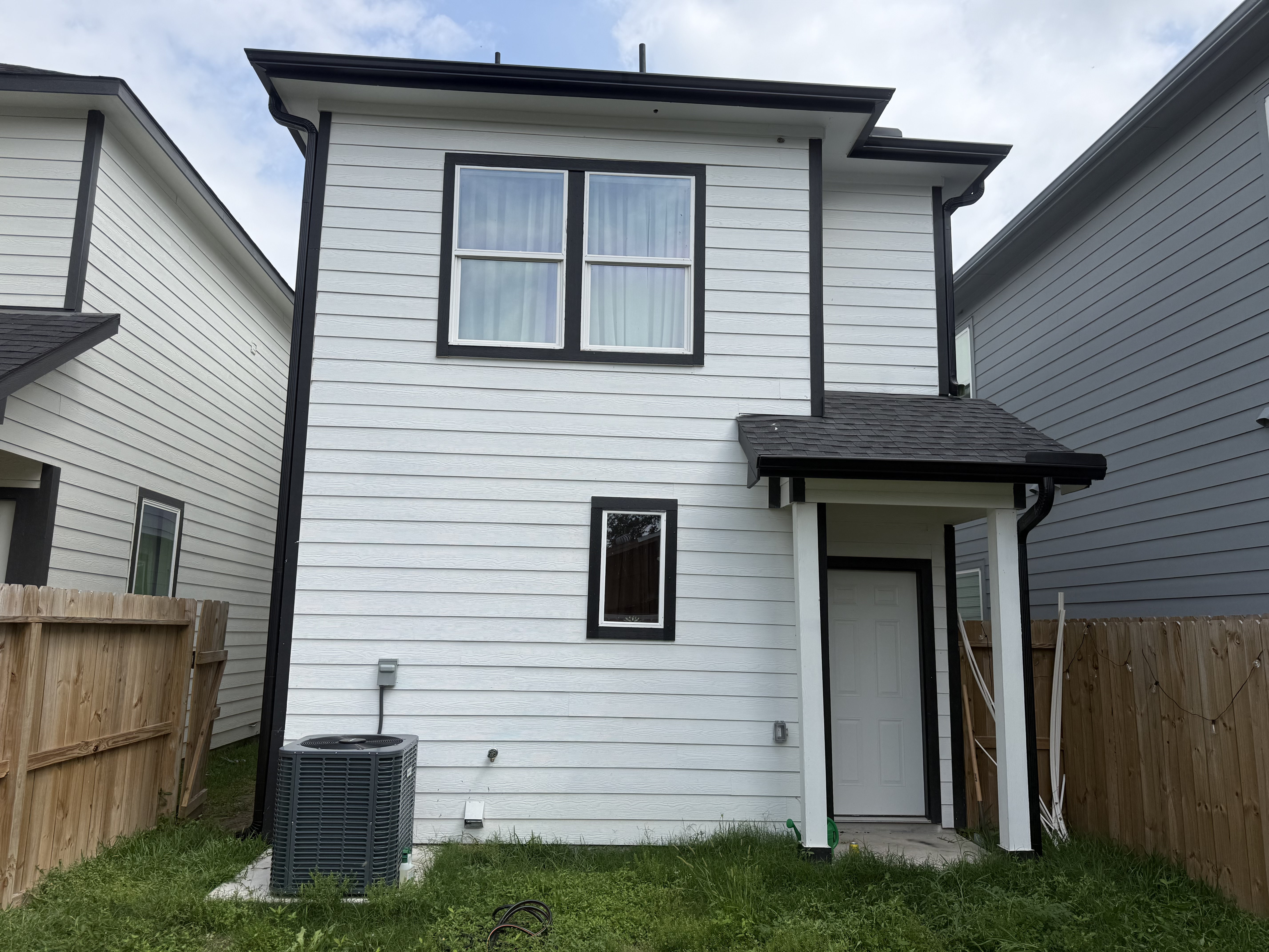 Completed white siding on two-story home